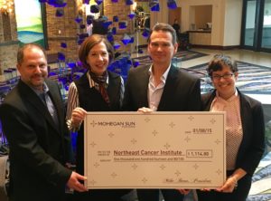 From left to right: Jeff George, vice president of hotel/ food and beverage at Mohegan Sun Pocono; Karen M. Saunders, president of the Northeast Regional Cancer Institute; Mike Bean, president of Mohegan Sun Pocono and Amanda Marchegiani, community relations coordinator at the Northeast Regional Cancer Institute.